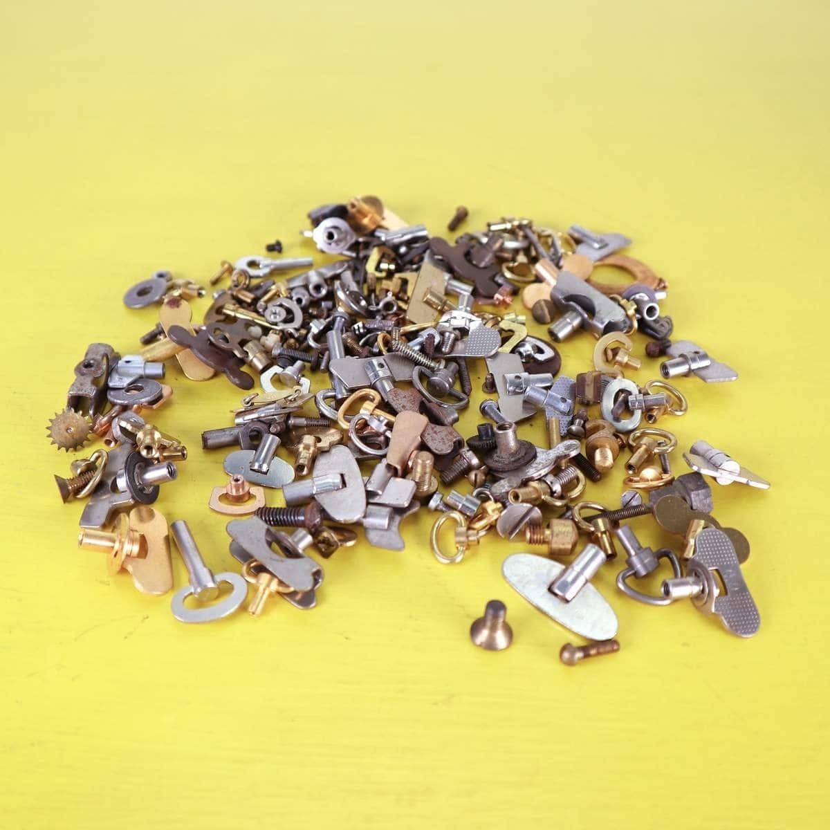 Lot Of Spare Parts For Alarm Clocks, Keys, Screws And More