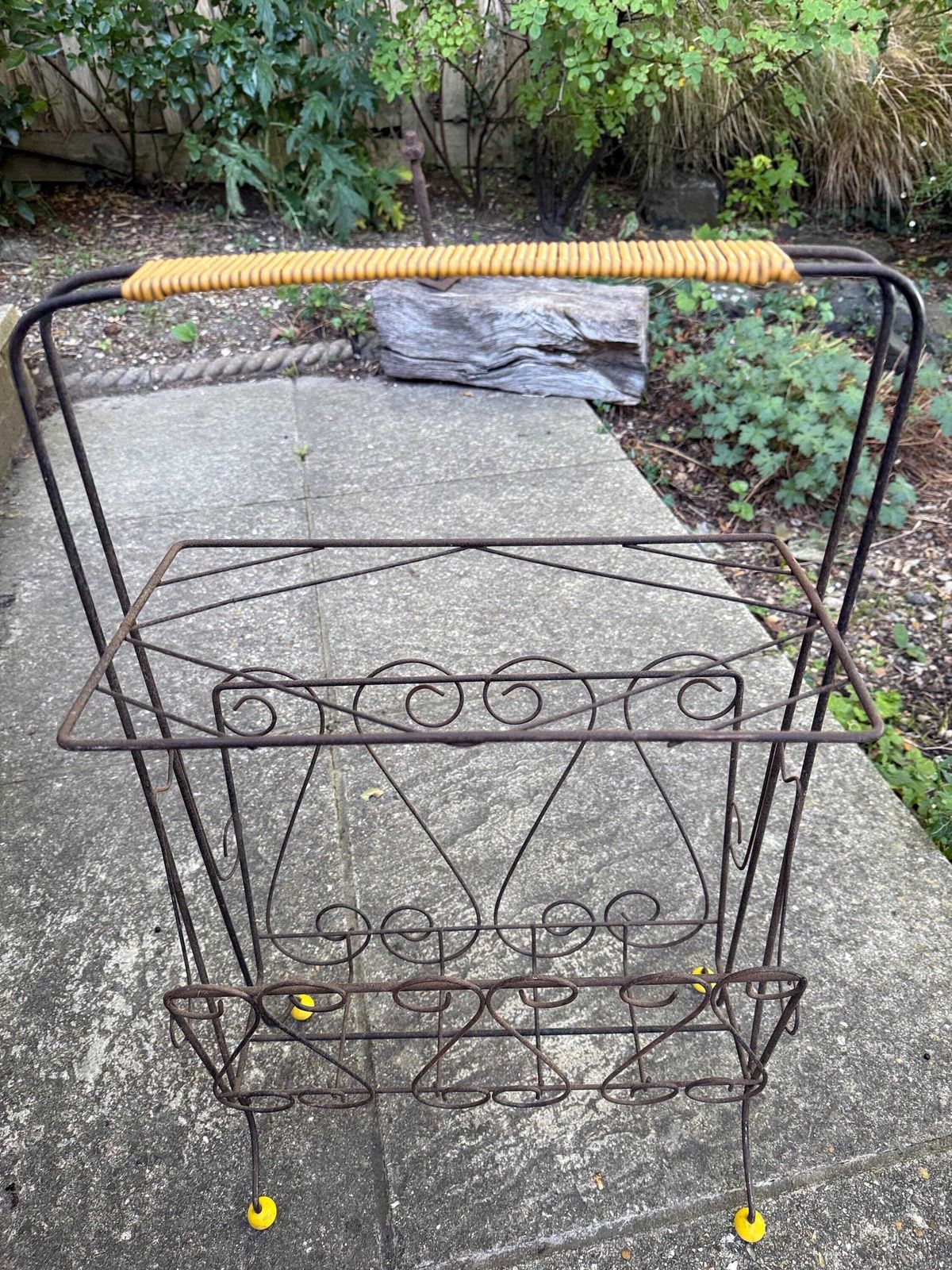 Vintage 1950s Wire Magazine Rack – Mid Century Scrollwork Storage Stand With Original Yellow Feet & Handle, Vintage Storage Rack   Towels? photo furniture