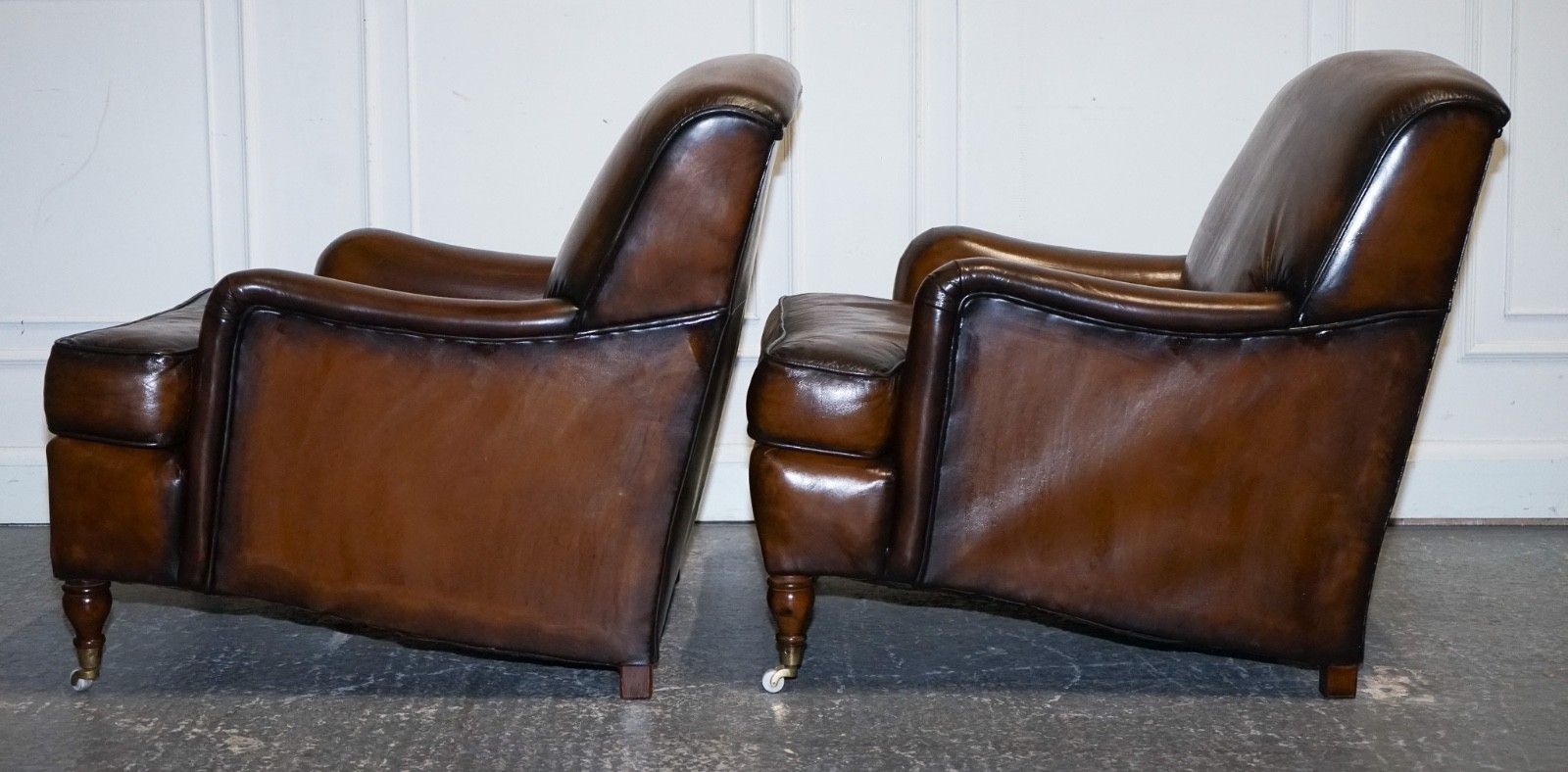 photo vinterior Pair Of Cigar Hand Dyed Leather Howard & Sons Style Armchairs On Castor Feet