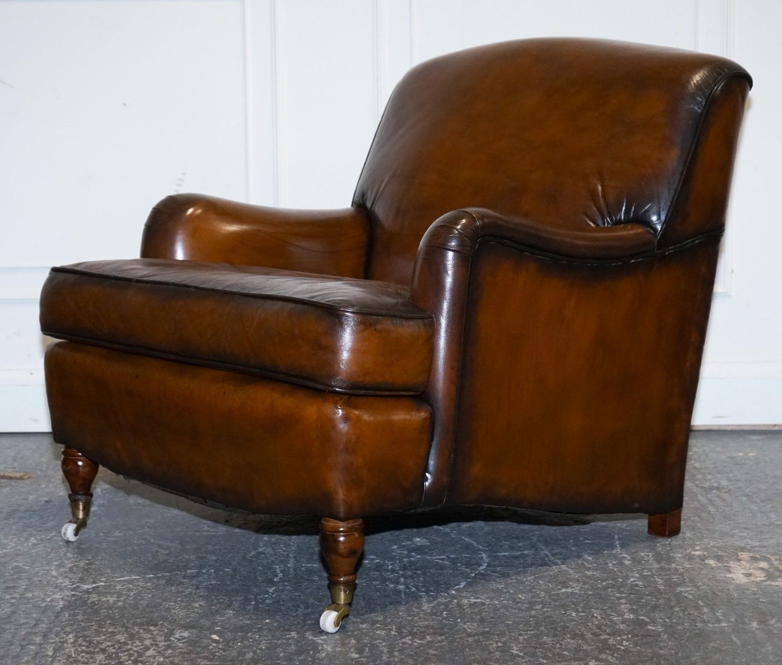photo vintage Pair Of Cigar Hand Dyed Leather Howard & Sons Style Armchairs On Castor Feet