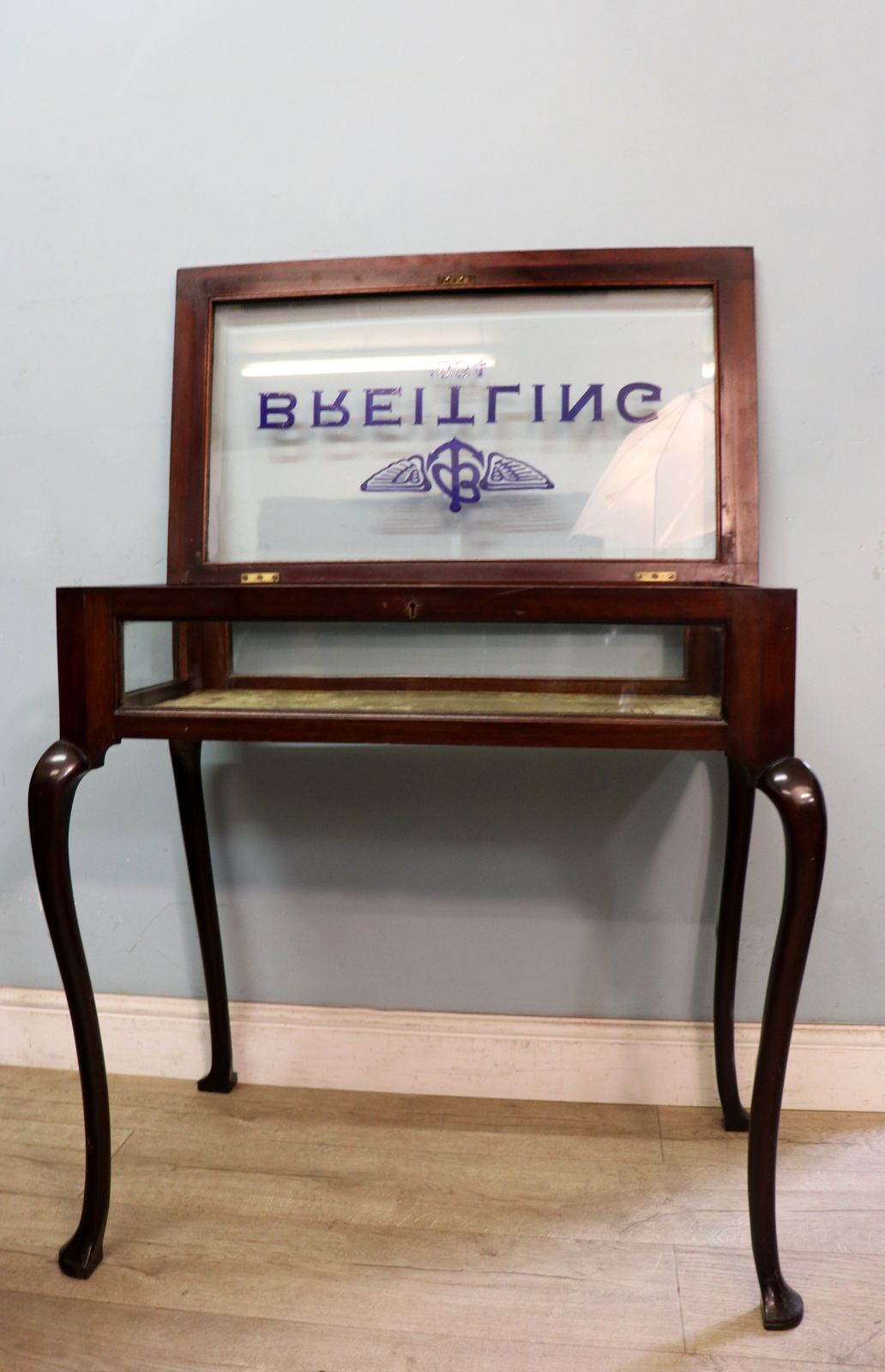 A Wonderful Vintage Bijouterie Display Table And Sign Written Detail For Breitling Watches. photo for sale