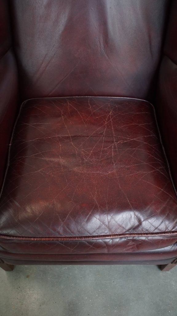 Charming And Comfortable Burgundy Red Cowhide Wing Chair In English Style With A Beautiful Patina photo vinterior