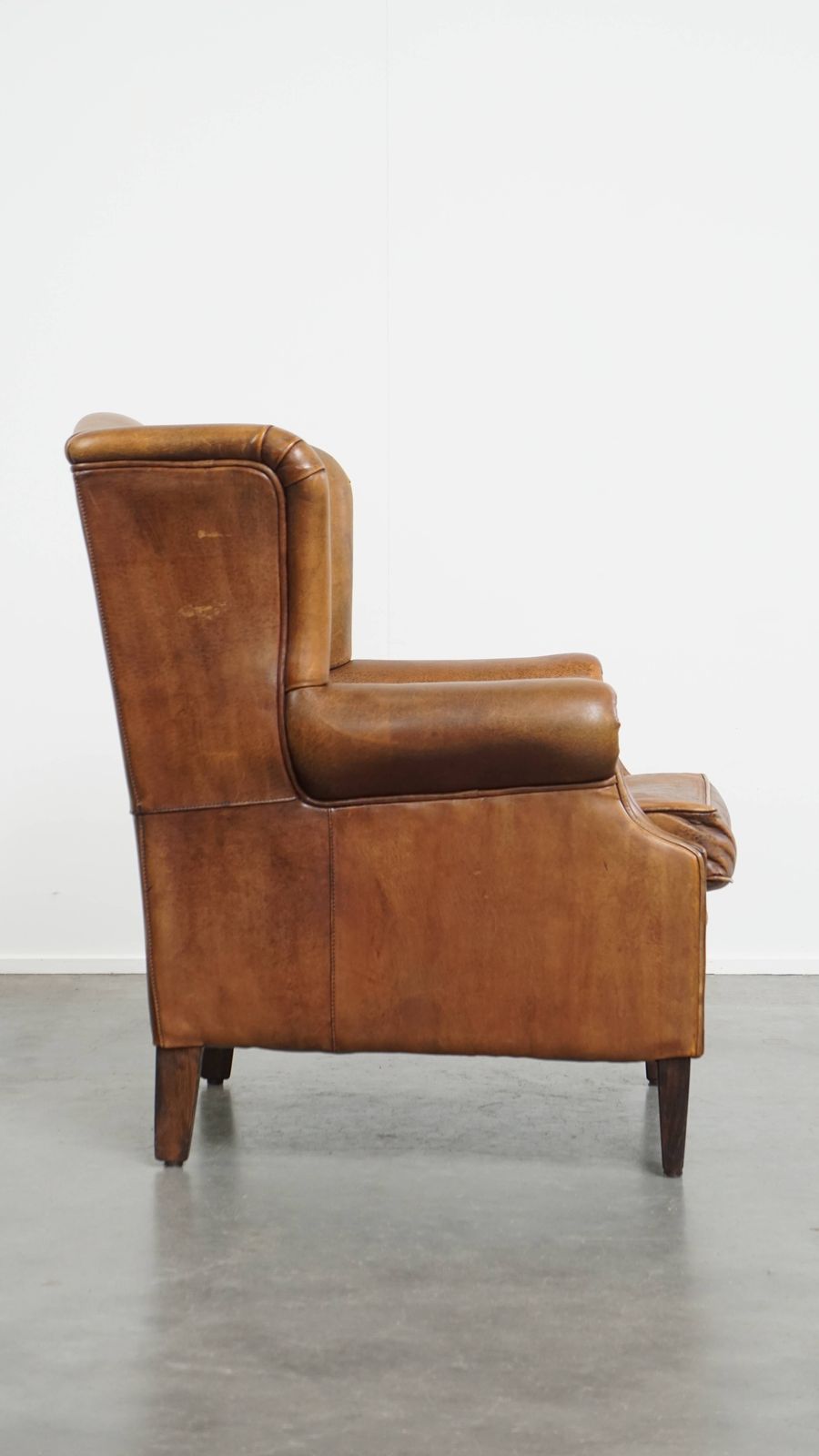 Wonderful, Characterful Vintage Sheepskin Wing Chair With A Beautiful Patina photo for sale