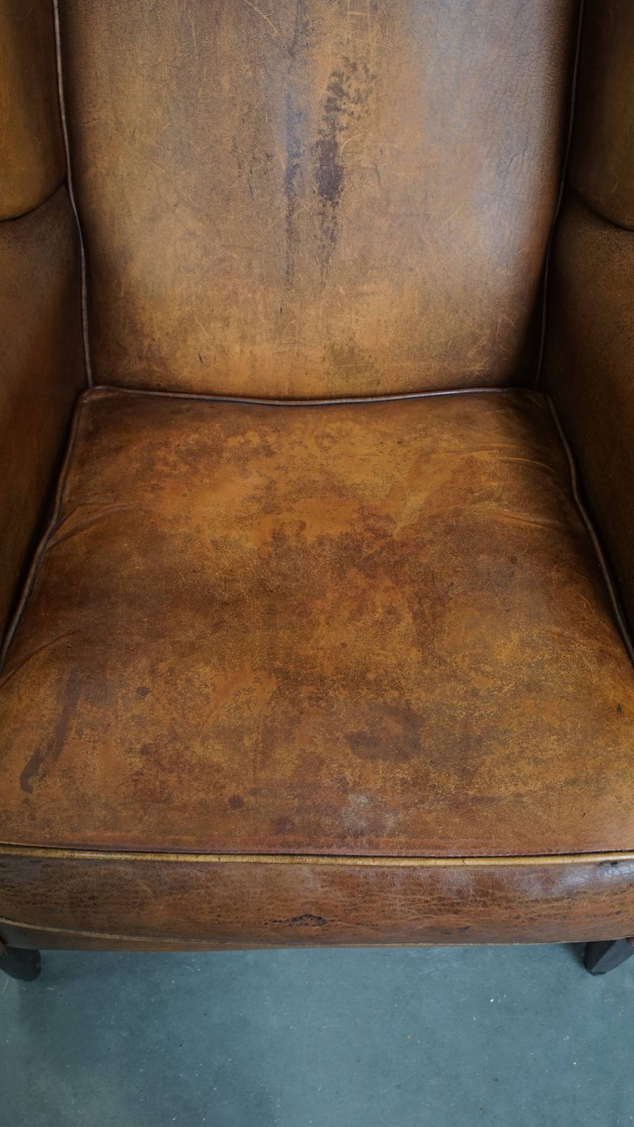 Wonderful, Characterful Vintage Sheepskin Wing Chair With A Beautiful Patina photo vinterior