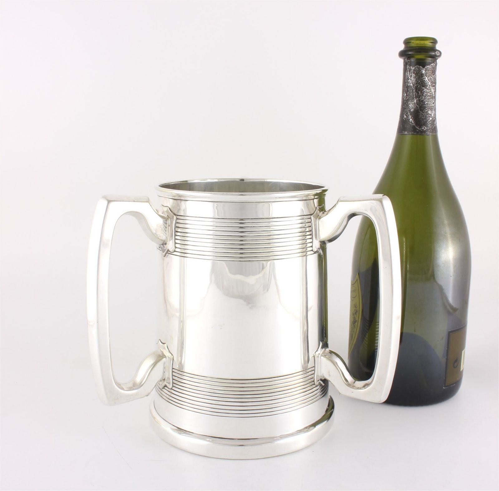 385.0 Silver Plate Three Handled Tyg. Glass Bottom Presentation Cup Tankard. photo