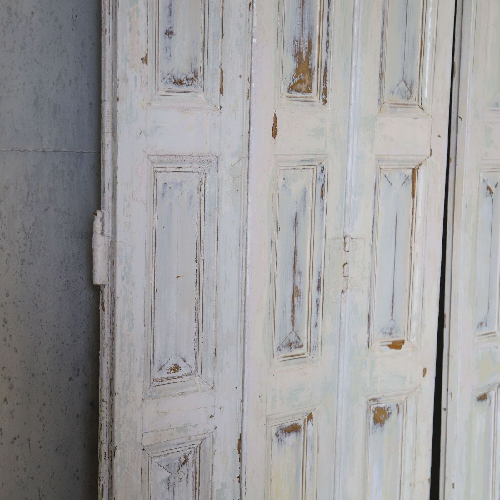 photo for sale Pair Of Antique Panelled Tri Folding Shutters In Original Cream Paint
