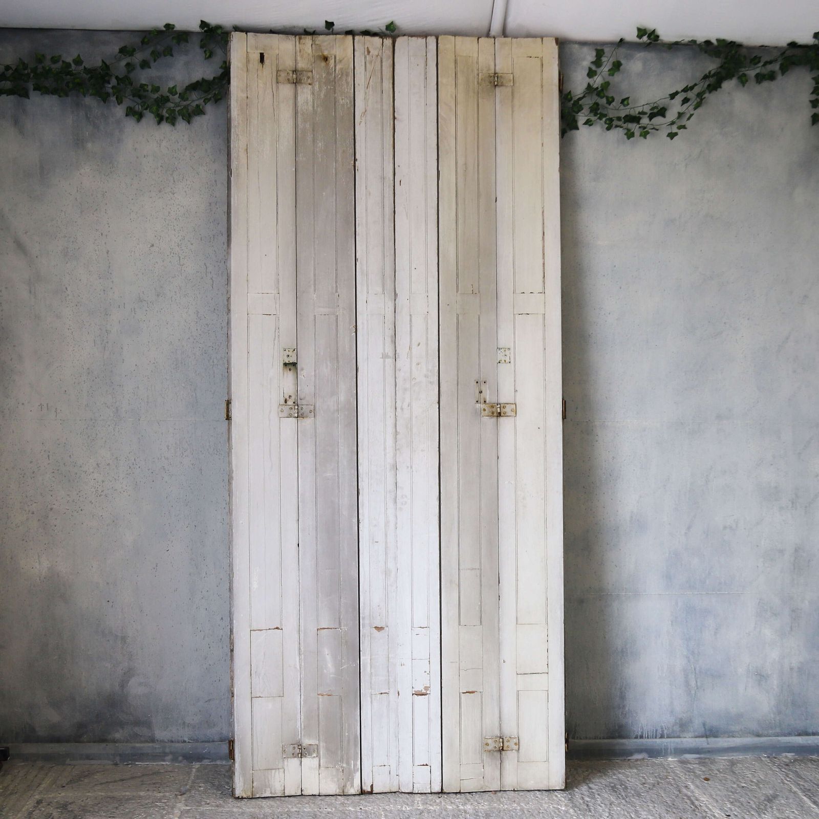Pair Of Antique Panelled Tri Folding Shutters In Original Cream Paint photo furniture