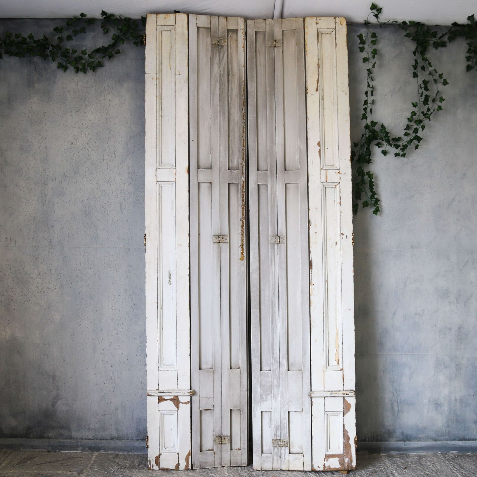 Pair Of Antique Panelled Tri Folding Shutters In Original Cream Paint photo vinterior