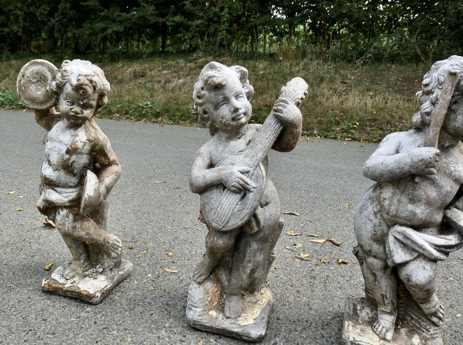 A Set Of 4 Weather Worn Cherub Statues With Instruments photo Art