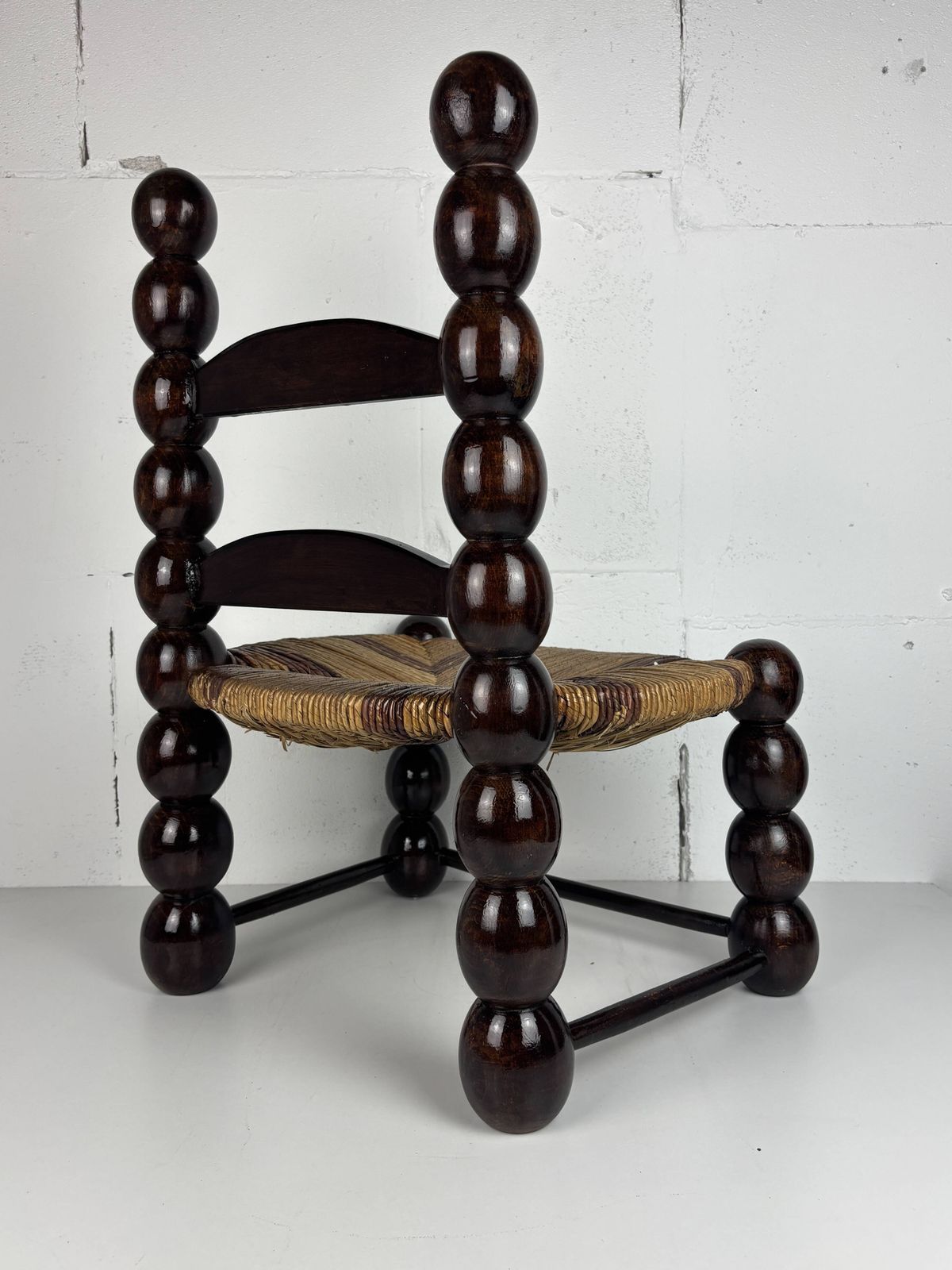 photo furniture Brutalist Wood Turned Bobbin Low Rush Chair N The Style Of Charles Dudouyt