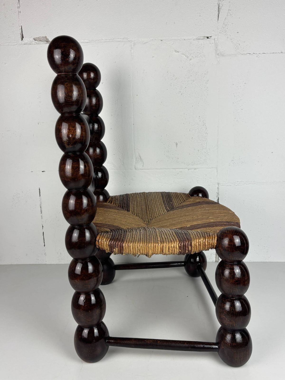 photo for sale Brutalist Wood Turned Bobbin Low Rush Chair N The Style Of Charles Dudouyt