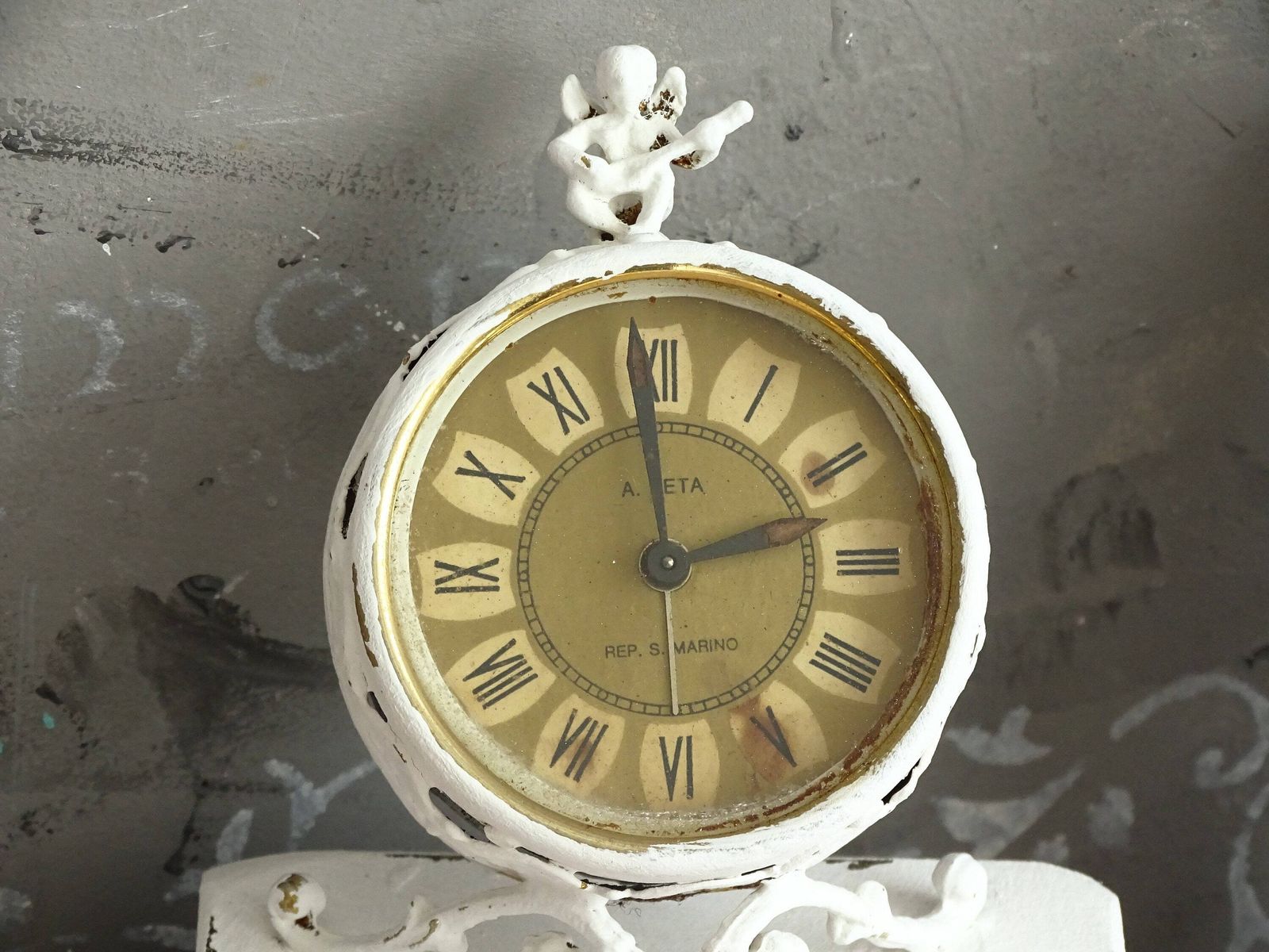 White Antique Cherub Table Clock: Tilted Rococo Metal Desk Decor photo furniture