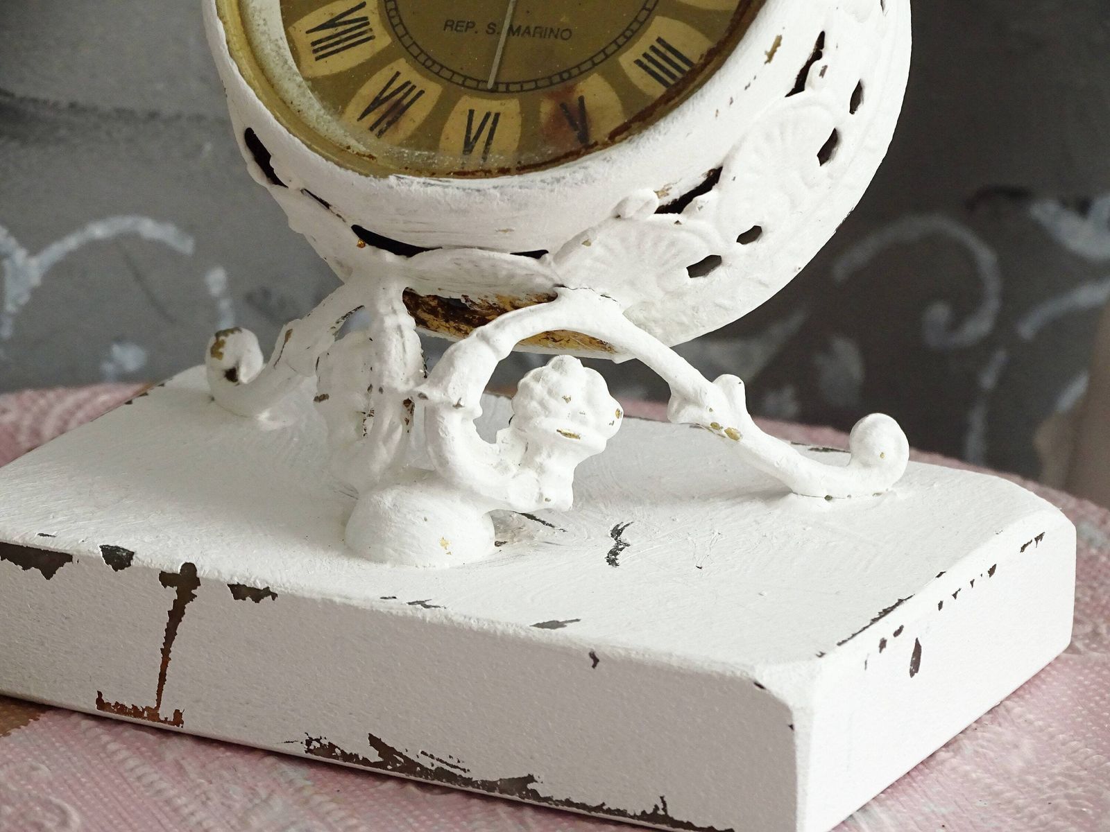 White Antique Cherub Table Clock: Tilted Rococo Metal Desk Decor photo vinterior