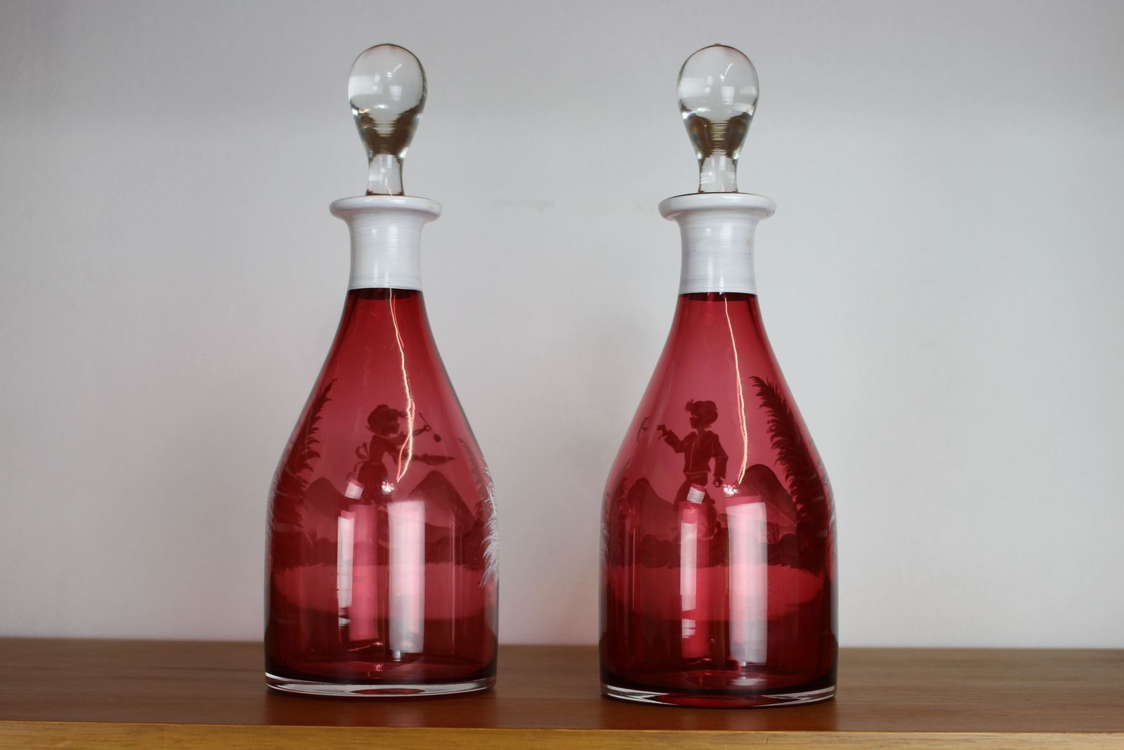 Pair Of Mary Gregory Style Cranberry Glass Decanters photo for sale