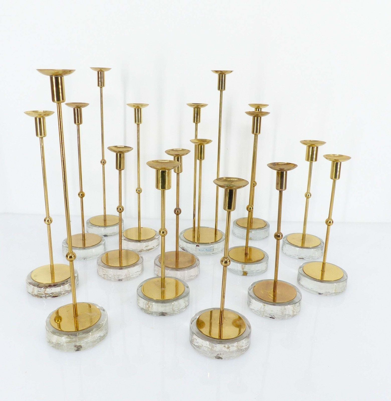 photo for sale Set Of 15 Scandinavian Candlesticks In Brass And Glass, Gunnar Ander, Ystad Metall, Sweden 1960