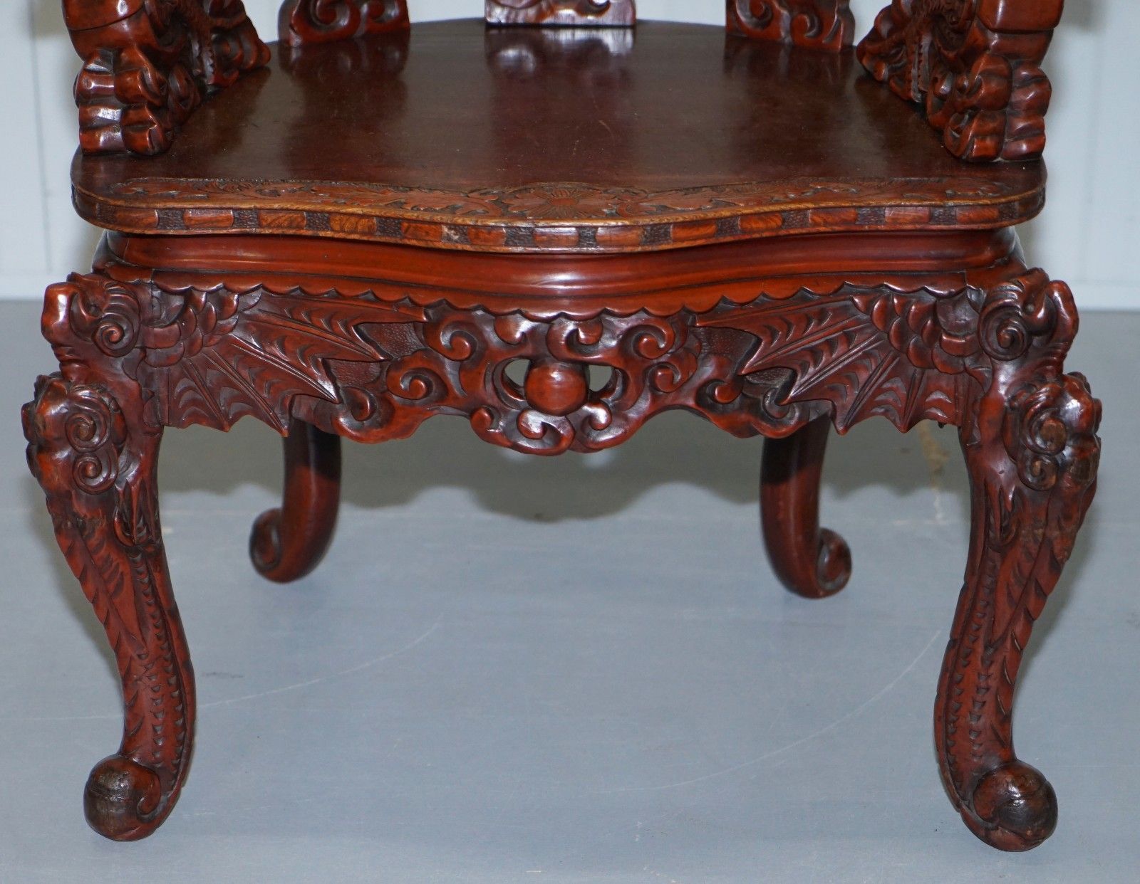 950.0 Vintage Chinese Red Lacquered Carved Elm Armchair With Heavy Foliage Detailing photo