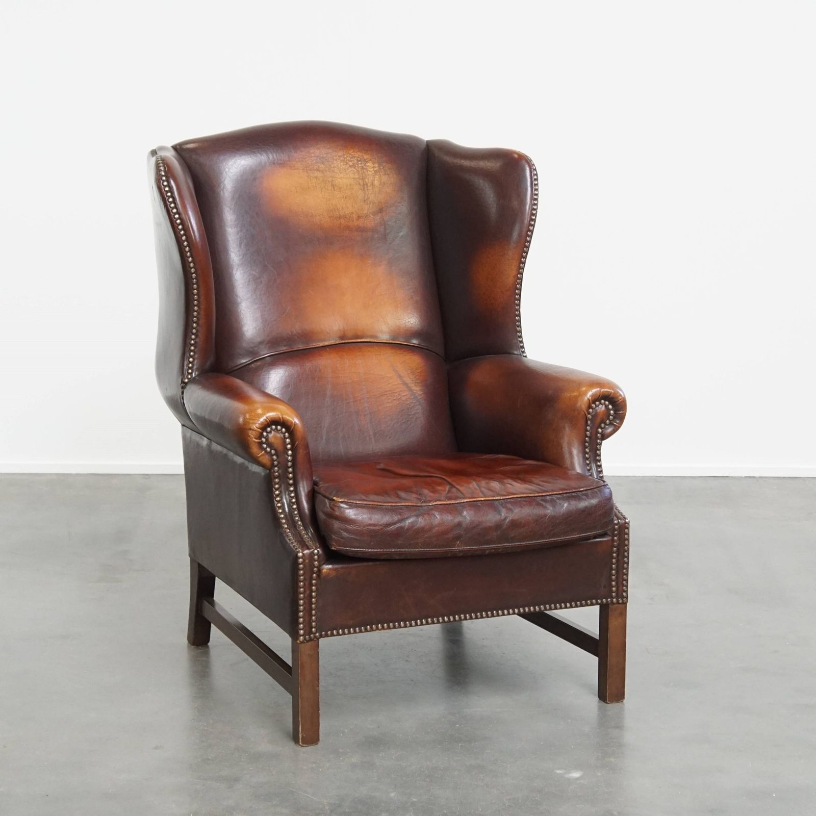 Luxurious, Classic And Comfortable Dark English Style Sheepskin Wing Chair With Lots Of Character And A Beautiful Patina
