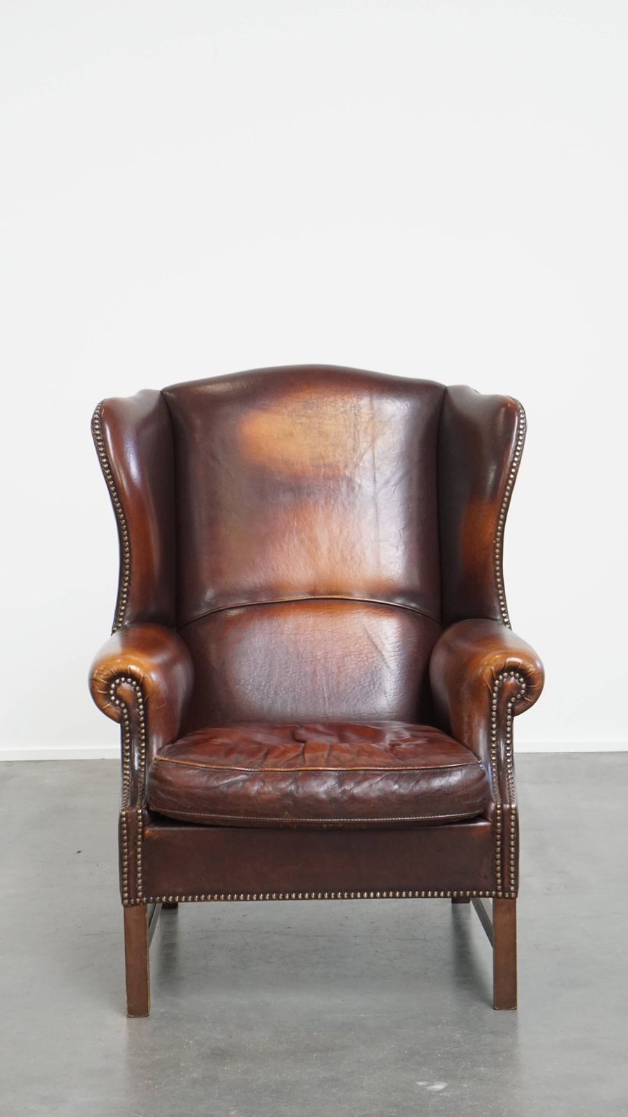 Luxurious, Classic And Comfortable Dark English Style Sheepskin Wing Chair With Lots Of Character And A Beautiful Patina photo furniture