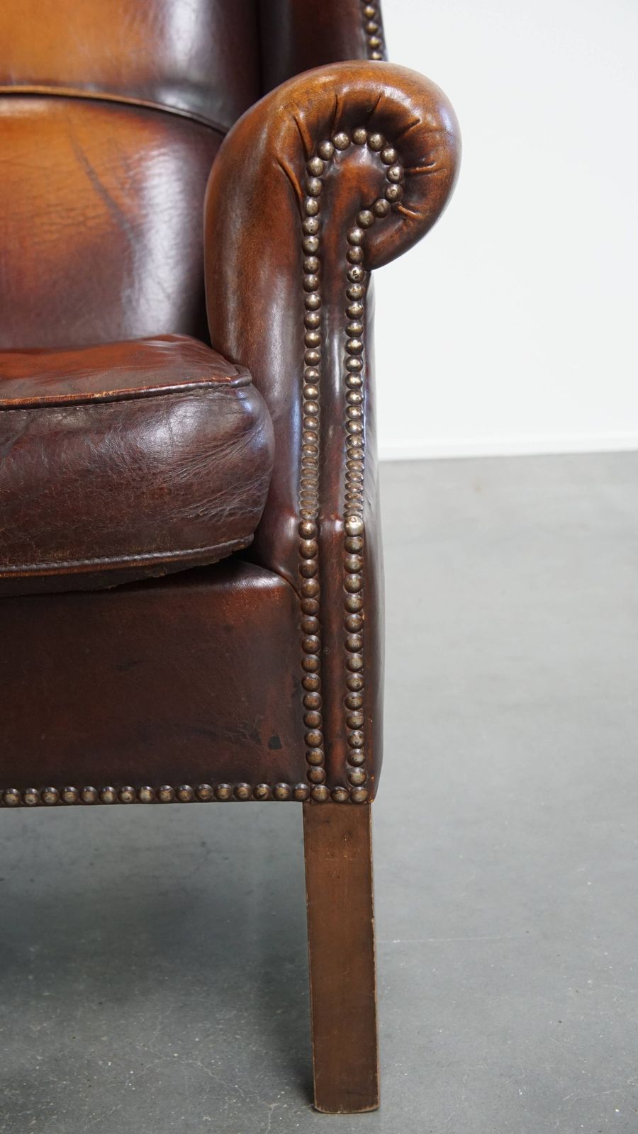 photo furniture Luxurious, Classic And Comfortable Dark English Style Sheepskin Wing Chair With Lots Of Character And A Beautiful Patina