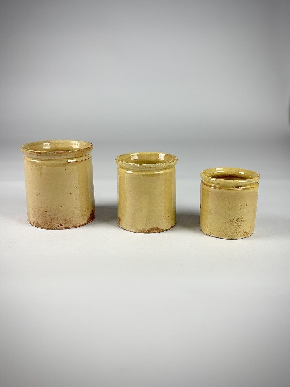 Collection Of Three Early 20th Century Yellow Slip Glazed Honey Pots photo furniture