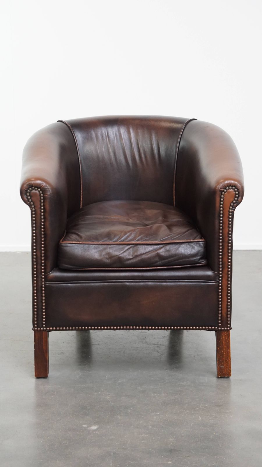 Elegant And Comfortable English Style Cowhide Club Armchair In A Beautiful Dark Color photo furniture