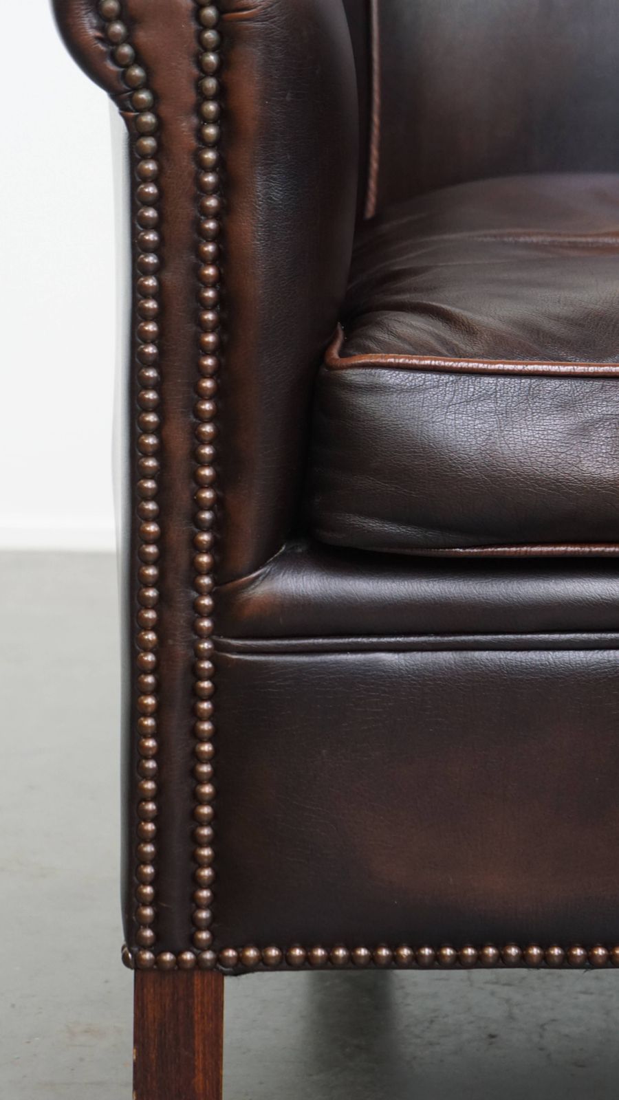 Furniture Elegant And Comfortable English Style Cowhide Club Armchair In A Beautiful Dark Color photo