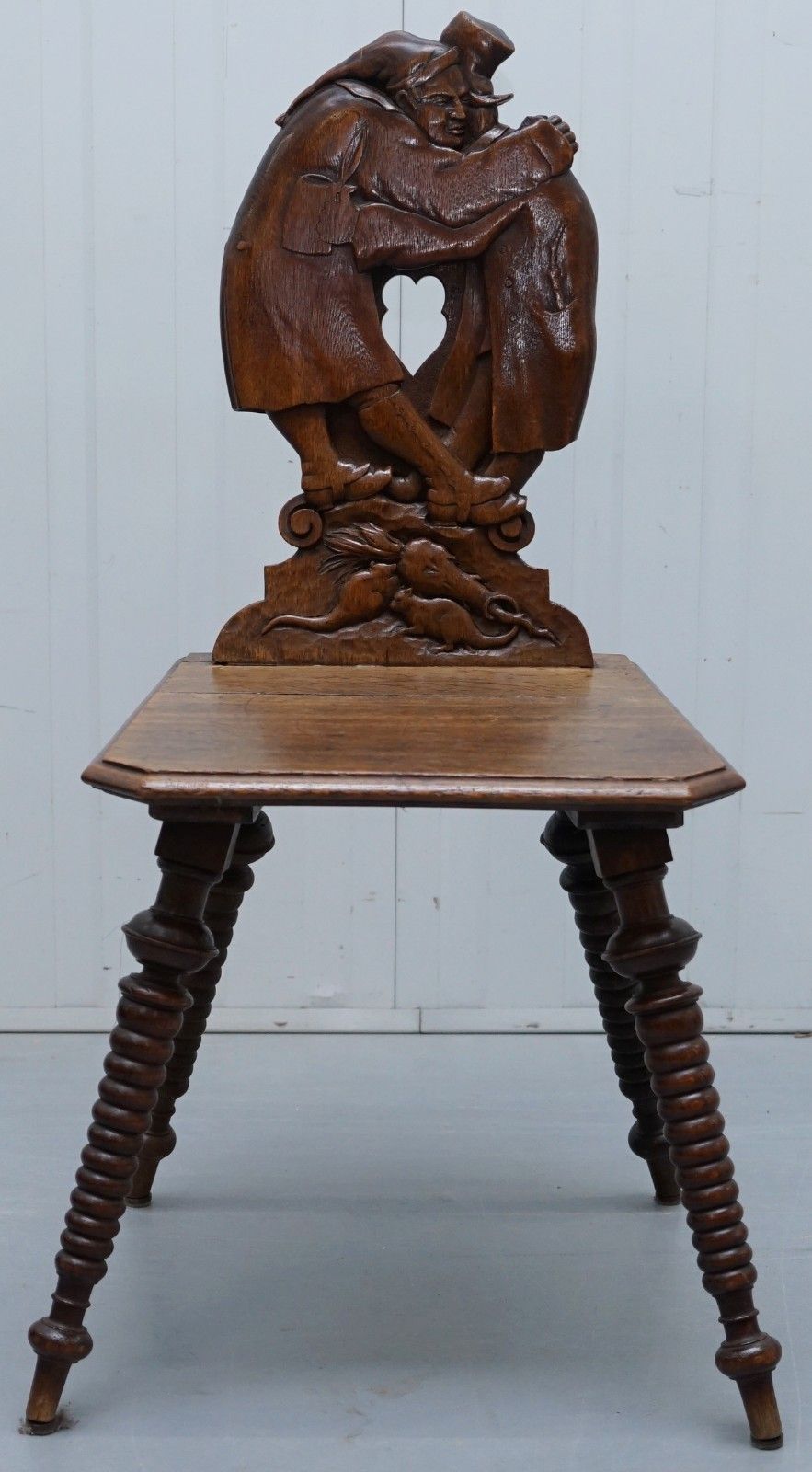 Black Forest Carve Oak Bobbin Hall Chair Depicting Two Friends Hugging Scrooge photo furniture
