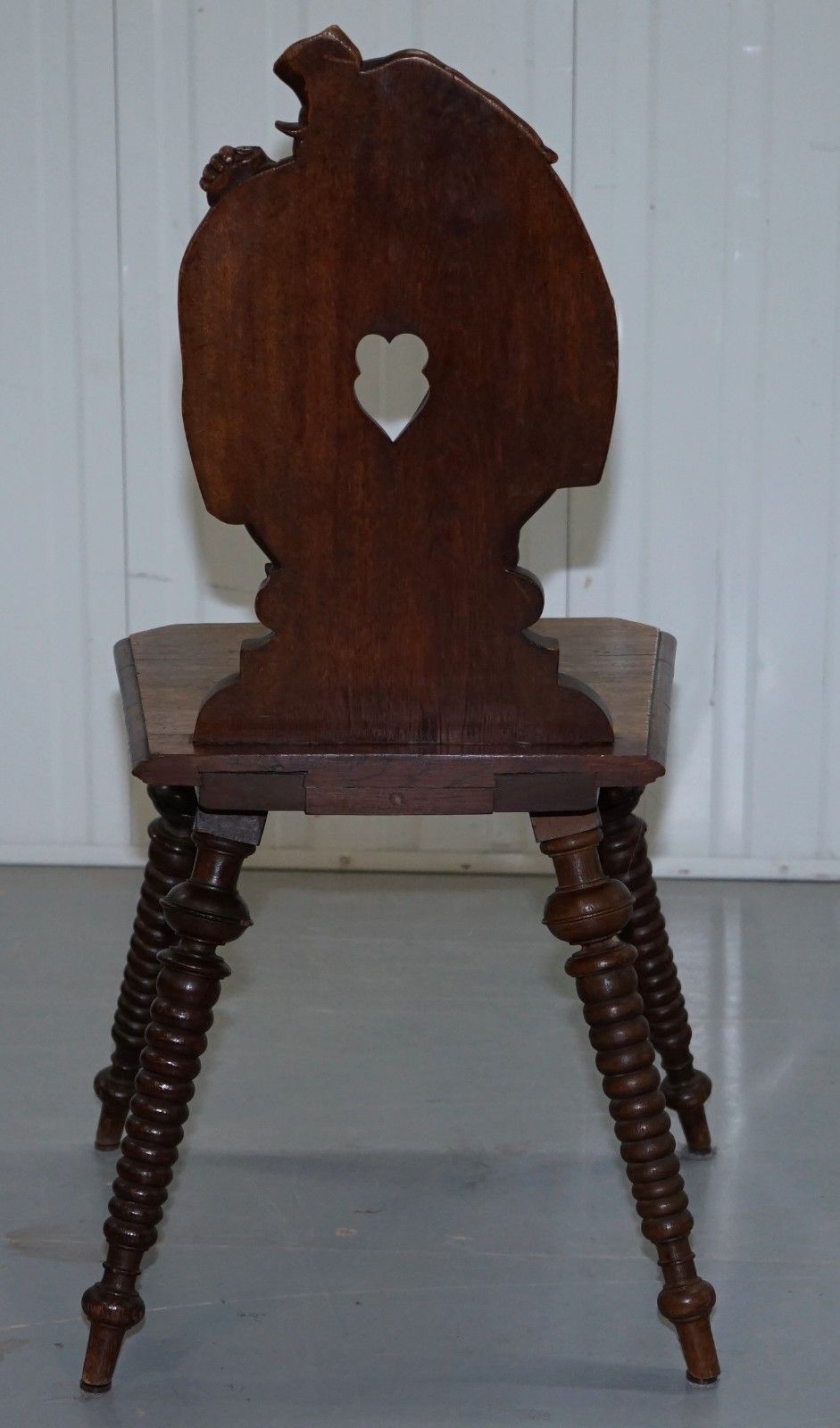 photo for sale Black Forest Carve Oak Bobbin Hall Chair Depicting Two Friends Hugging Scrooge