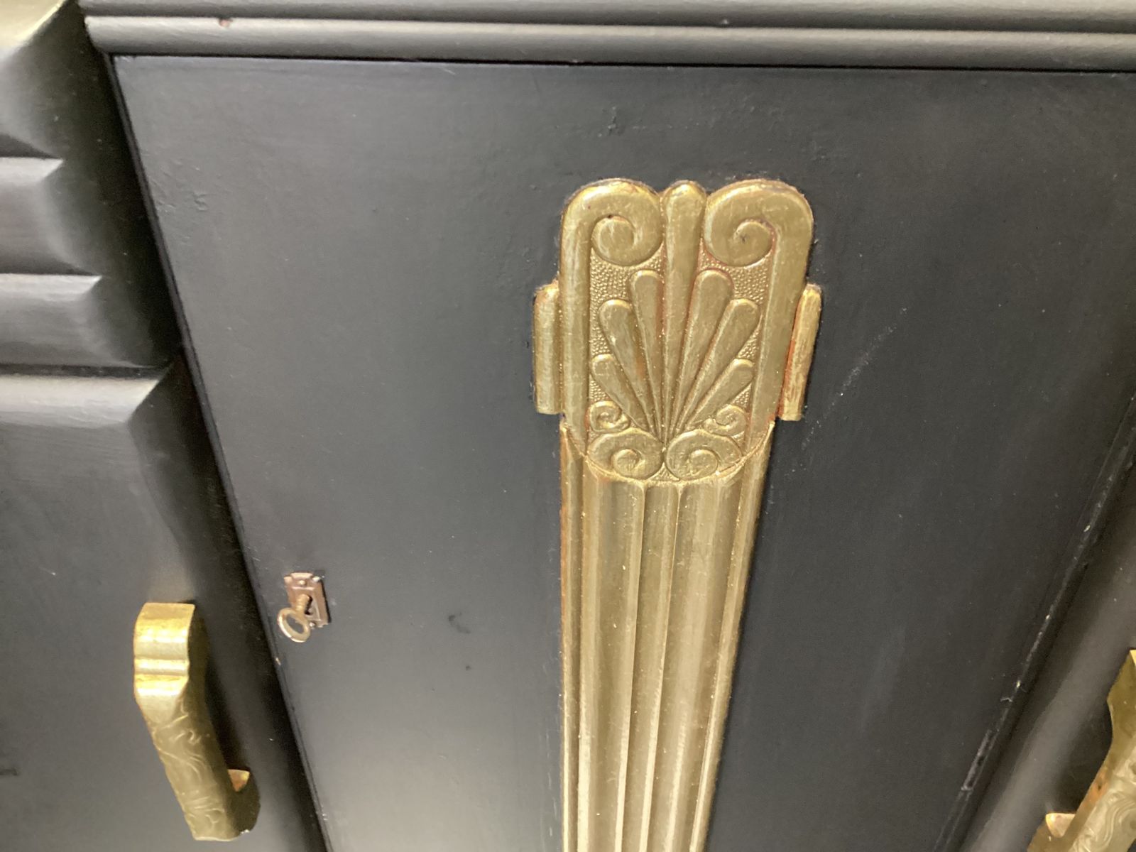 Art Deco Black And Gold Dresser With Gold  Detailing Interior Shelving And Bottle Storage photo furniture