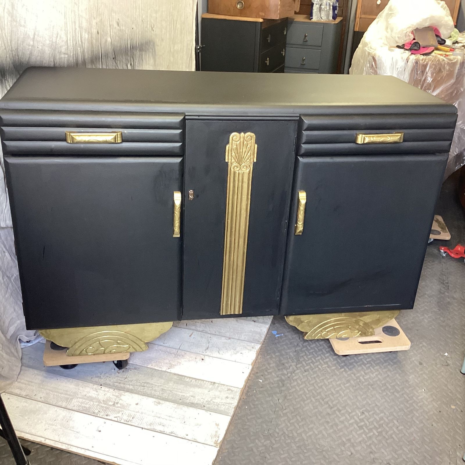 Art Deco Black And Gold Dresser With Gold  Detailing Interior Shelving And Bottle Storage photo vinterior