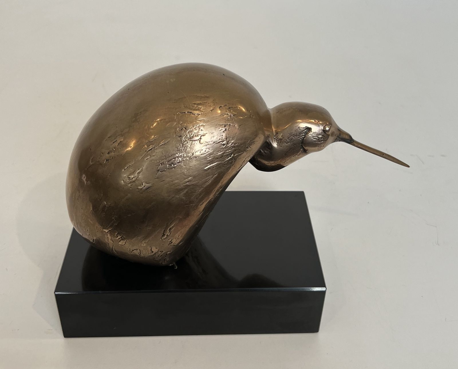 Bronze Sculpture Representing A Stylized Bird On A Black Marble Base, Signed And Numbered photo furniture
