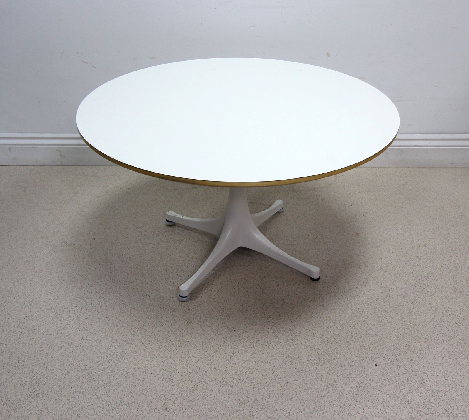 A Vitra Round White Pedestal Coffee Side Table By George Nelson