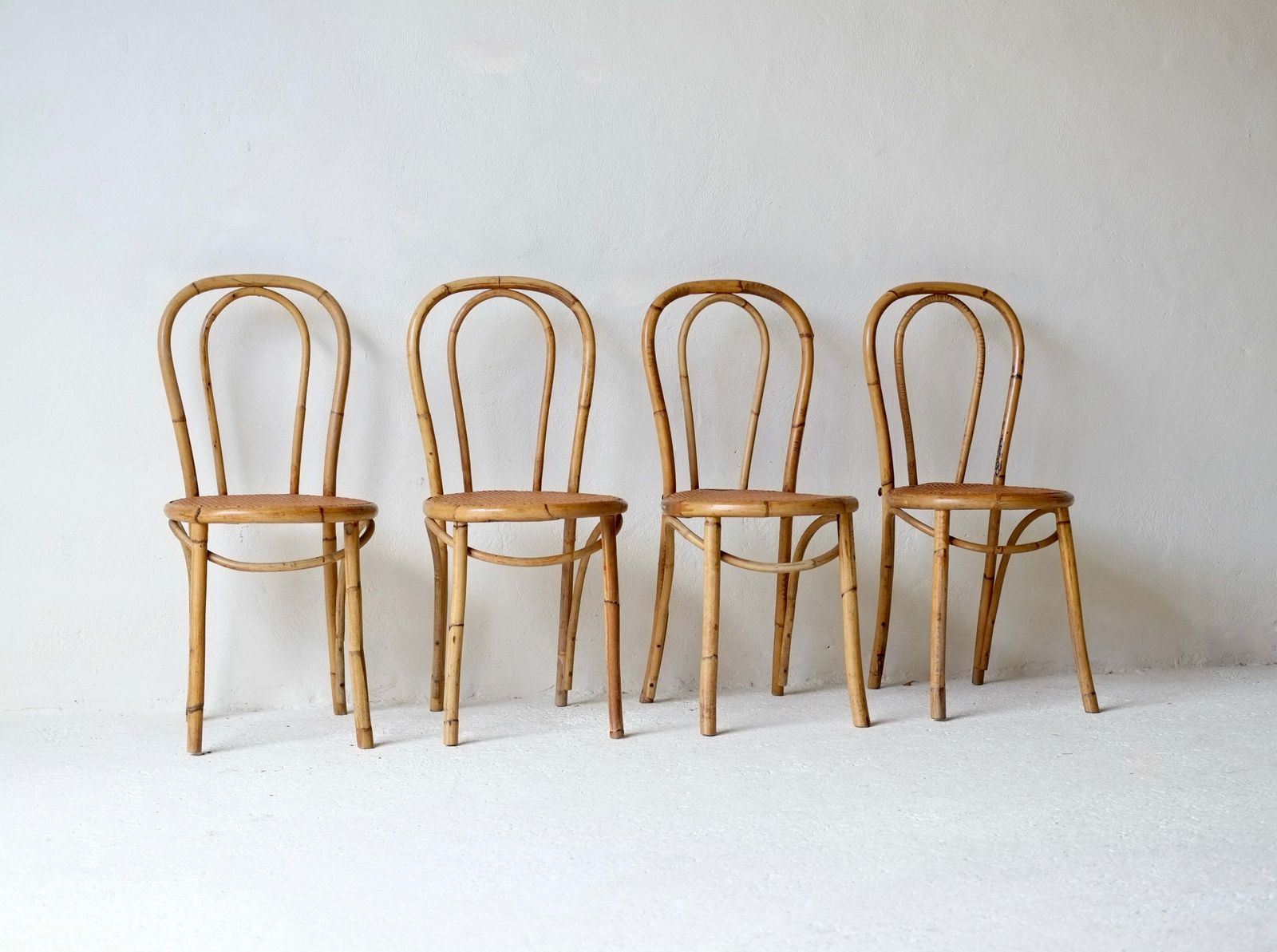 A Set Of Four French Midcentury Bamboo Dining Chairs photo buy