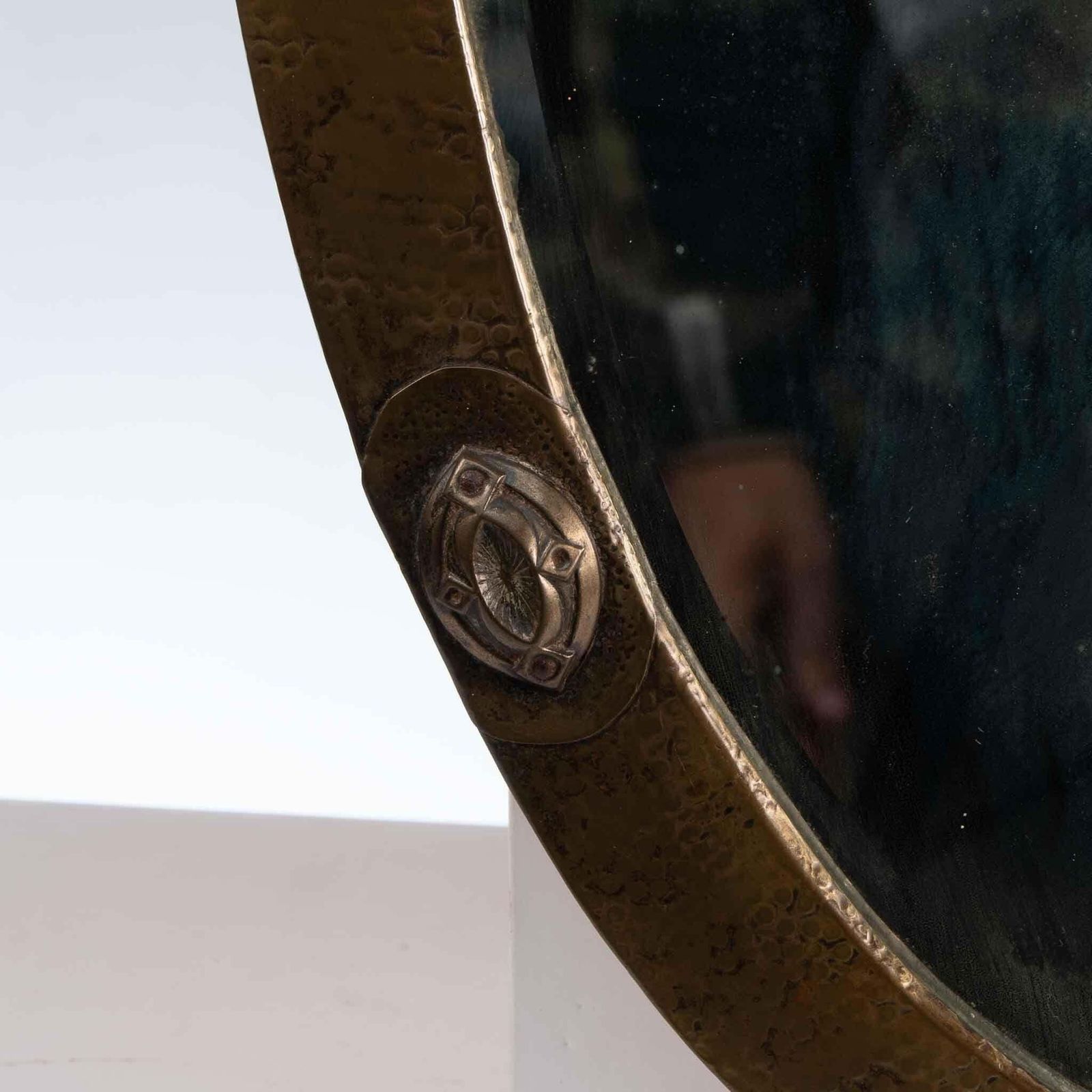 An Arts And Crafts Brass Hand Hammered Mirror With Four Celtic Style Details photo vinterior