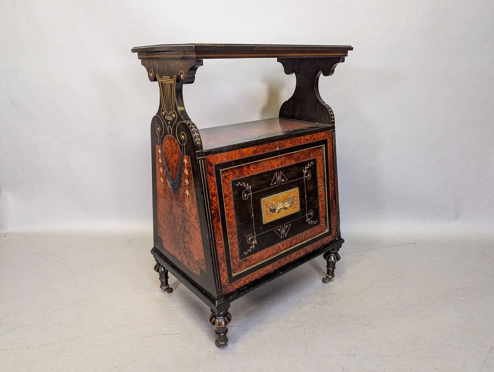 An Aesthetic Movement Amboyna And Ebonized Music Cabinet With Gilt Decoration photo furniture
