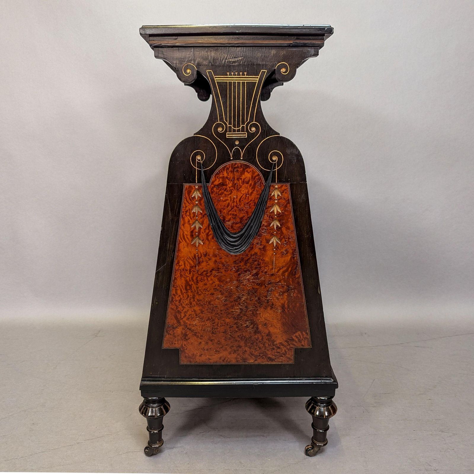 2856.0 An Aesthetic Movement Amboyna And Ebonized Music Cabinet With Gilt Decoration photo