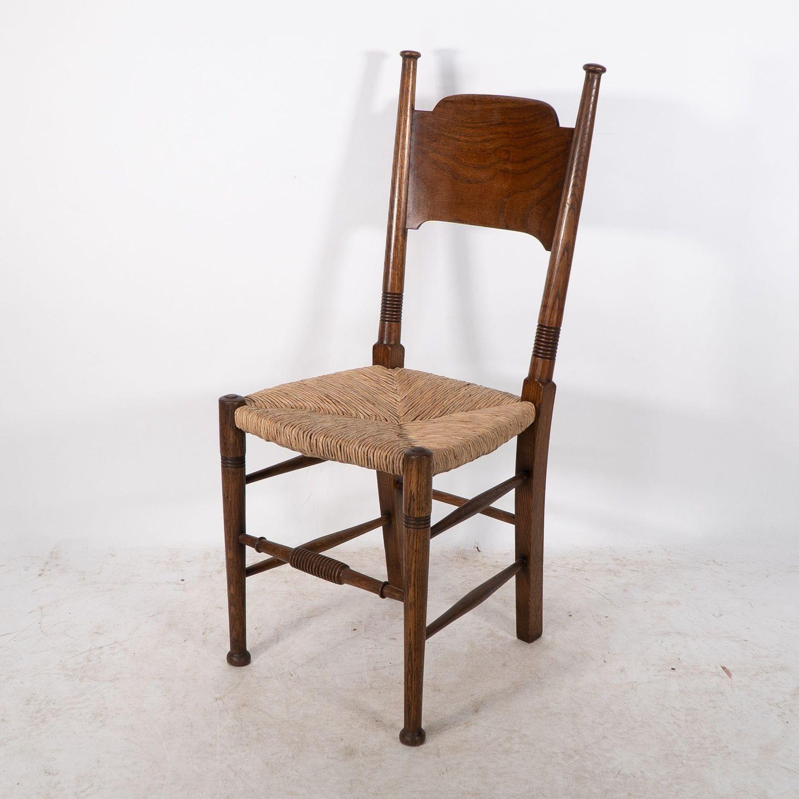 William Birch. Liberty & Co. A Arts And Crafts Rush Seat Oak Dining Chair photo for sale