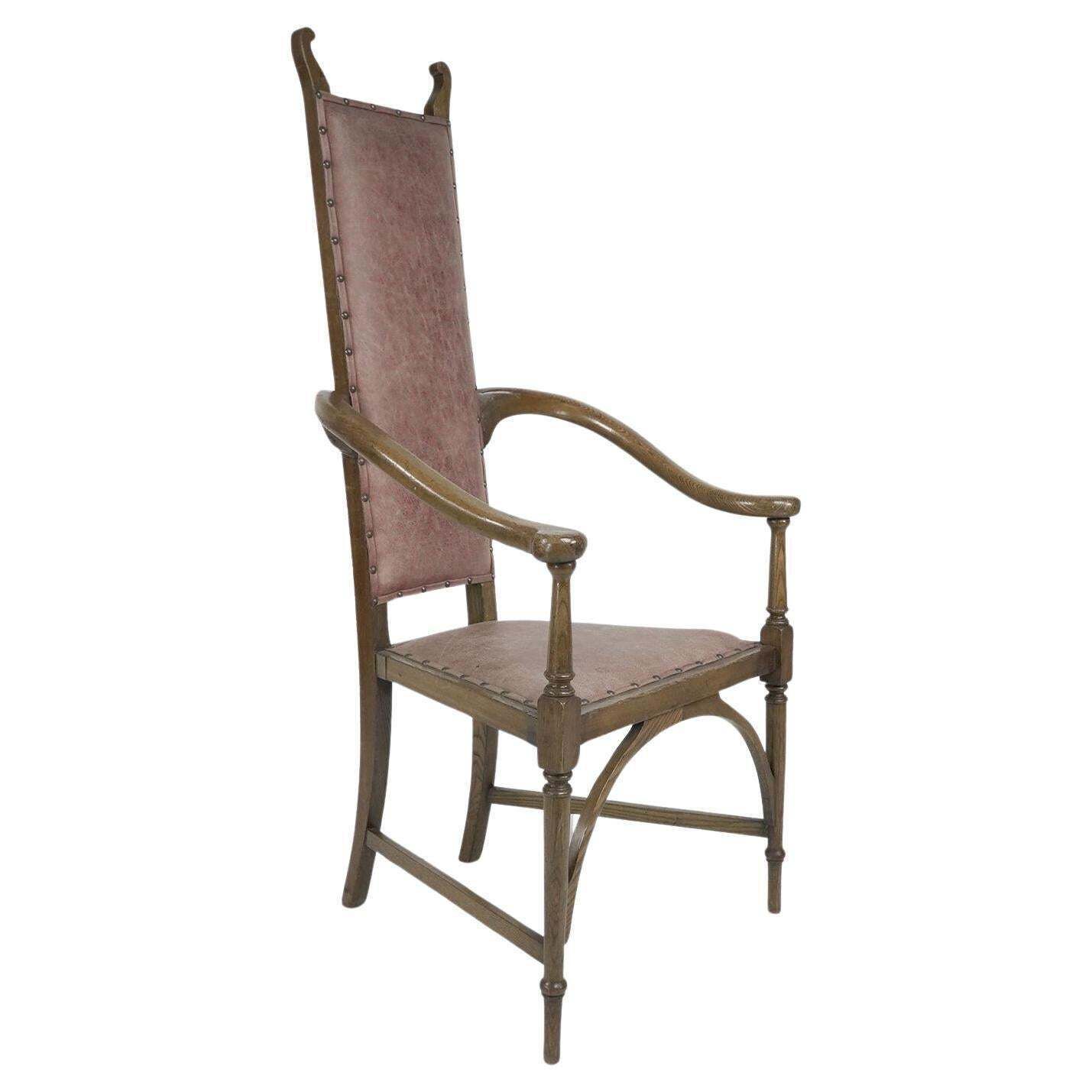 J S Henry. An Ash Arts & Crafts Armchair With An Elongated Back & Curled Ears