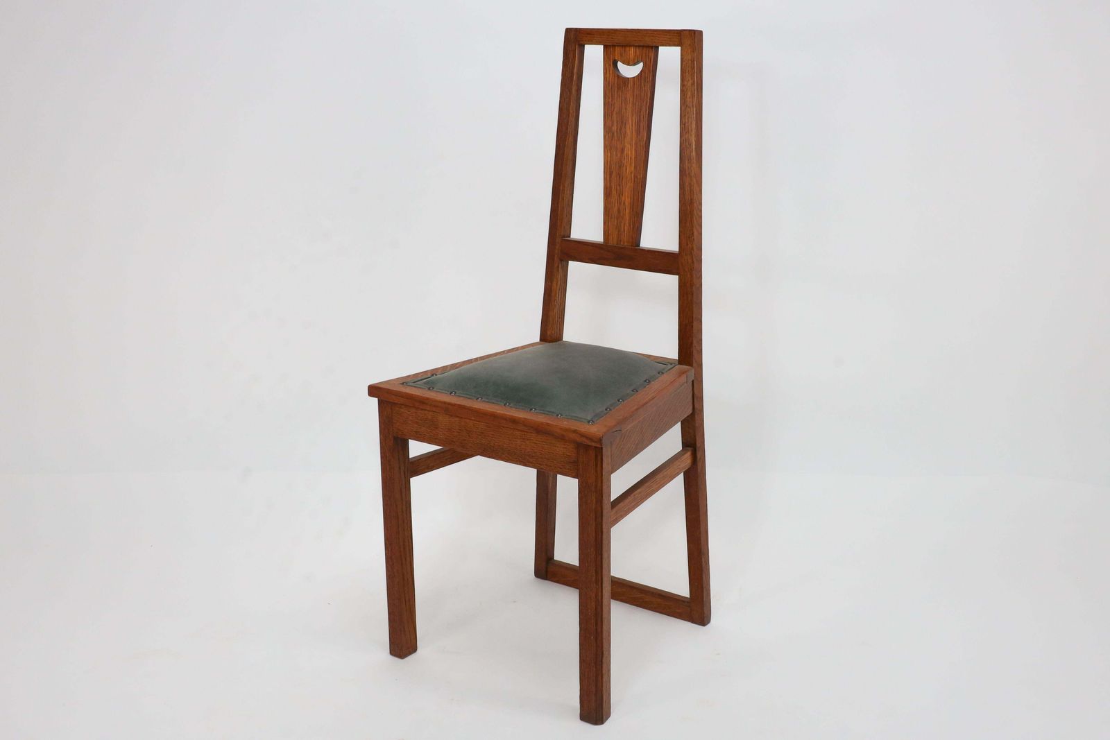 E A Taylor. A Set Of Five Arts And Crafts Oak Side Chairs With Heart Cut Outs. photo Furniture