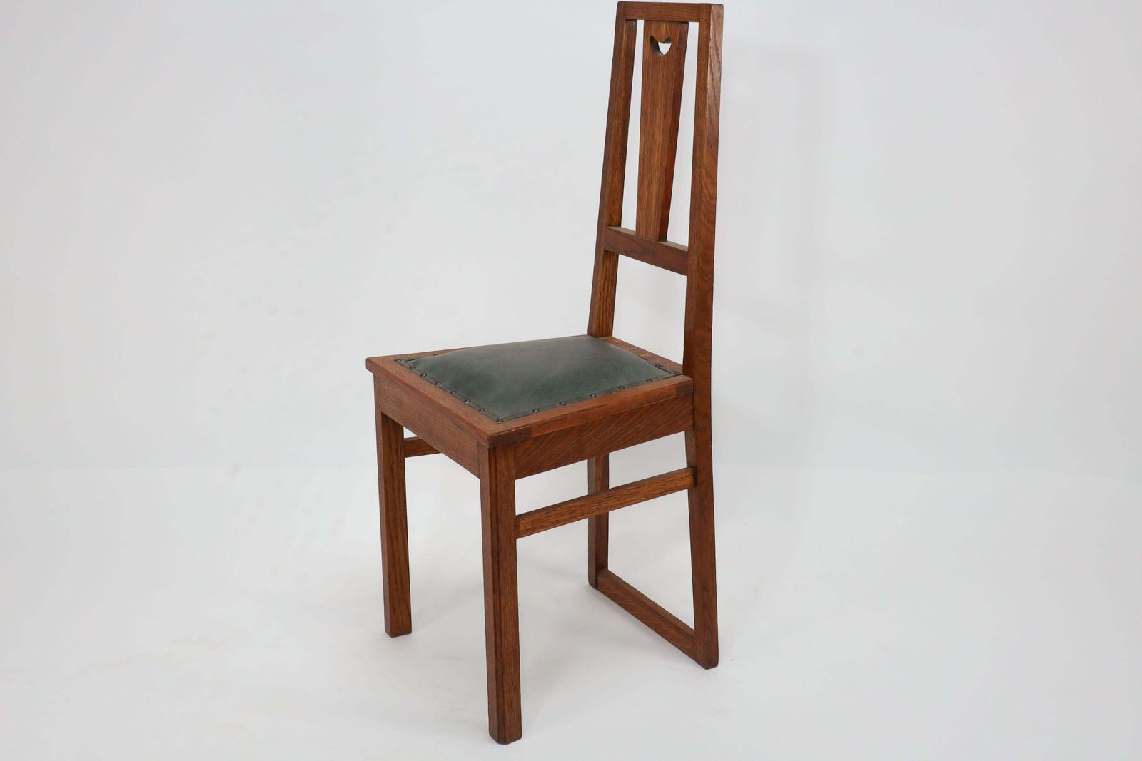 E A Taylor. A Set Of Five Arts And Crafts Oak Side Chairs With Heart Cut Outs. photo vintage