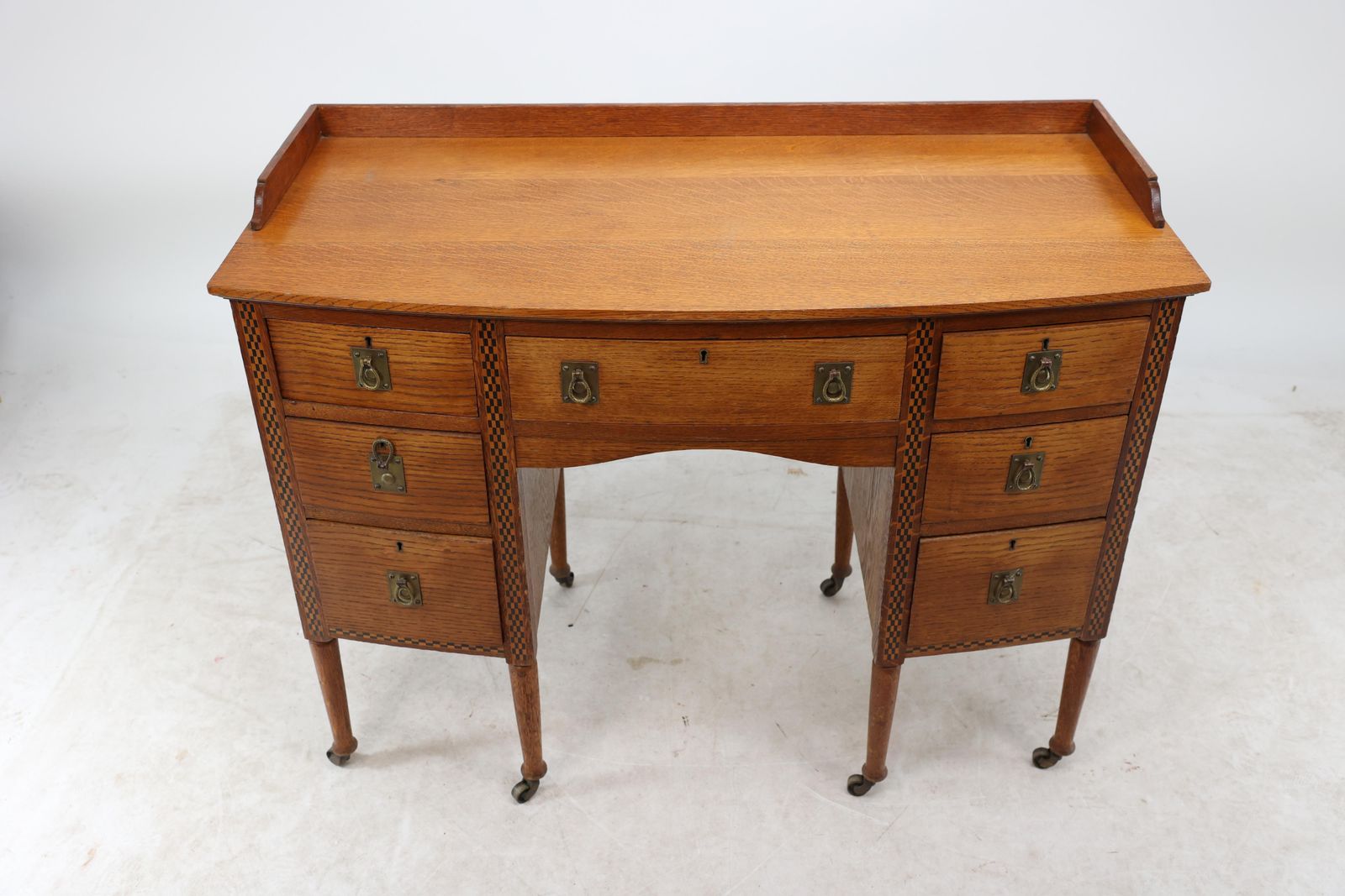 Waring And Gillow. An Arts And Crafts Bow Fronted Kneehole Twin Pedestal Desk photo buy