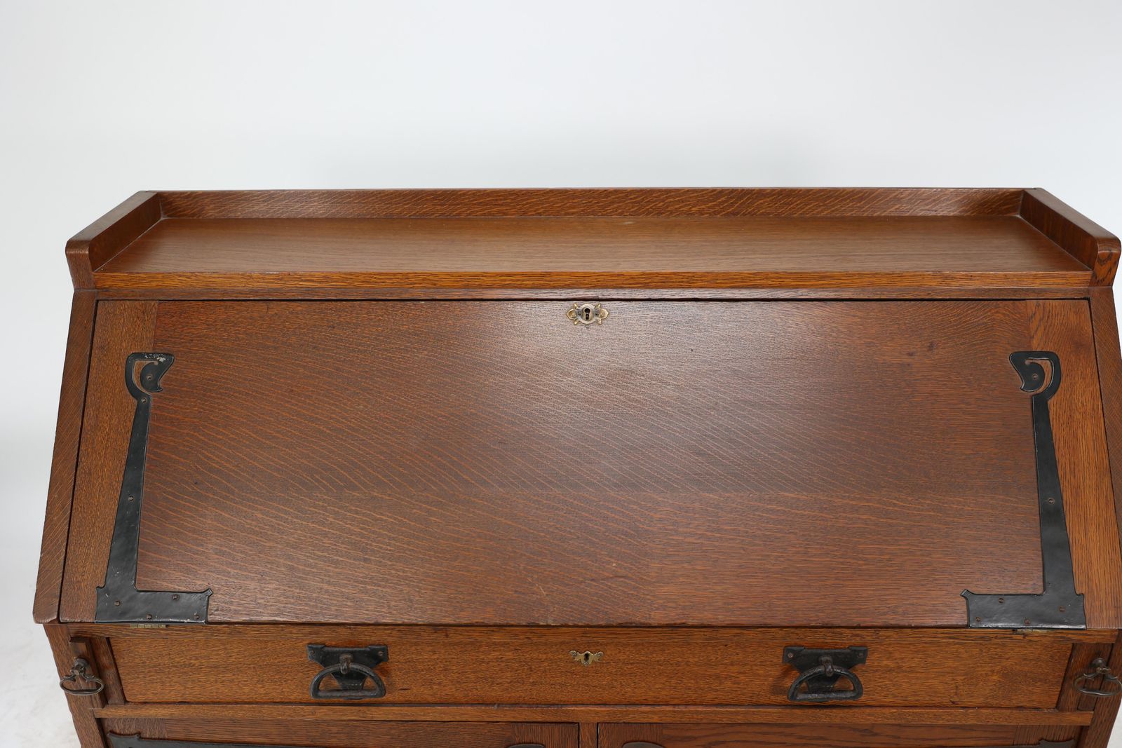 photo buy Leonard Wyburd For Liberty & Co. An Arts & Crafts Oak Bureau With Iron Hinges