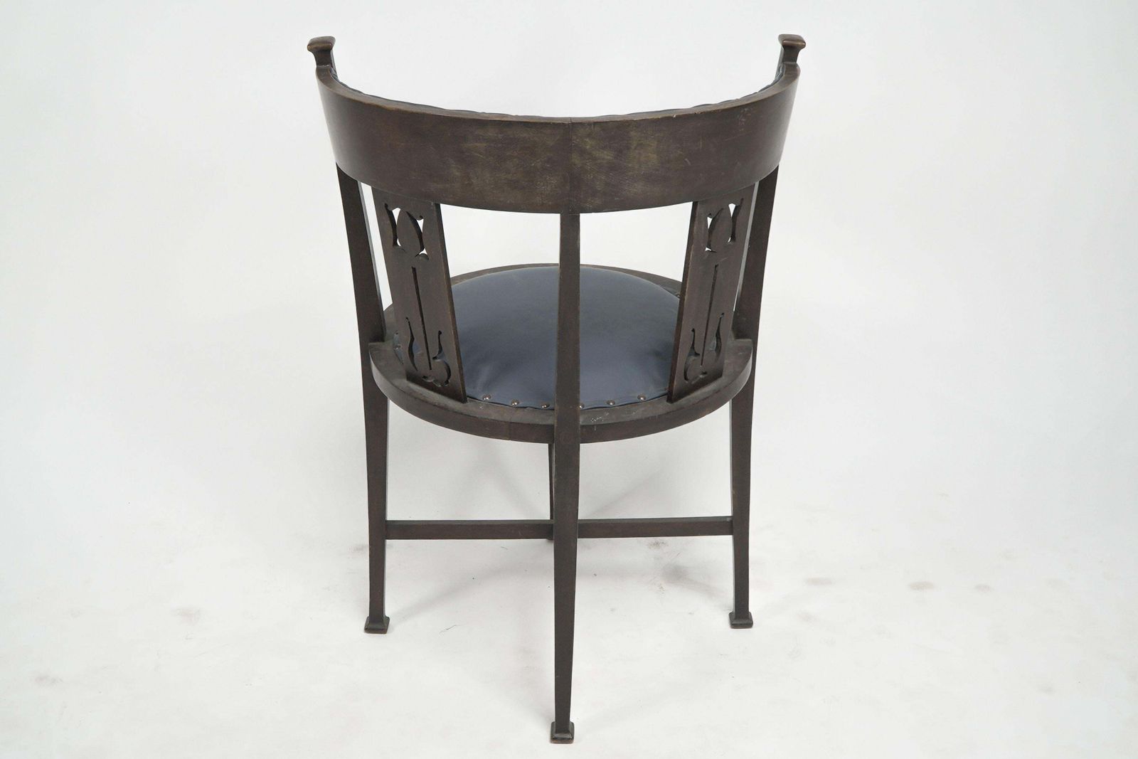 An Arts And Crafts Mahogany Tub Chair With Stylized Floral Cut Outs photo Furniture