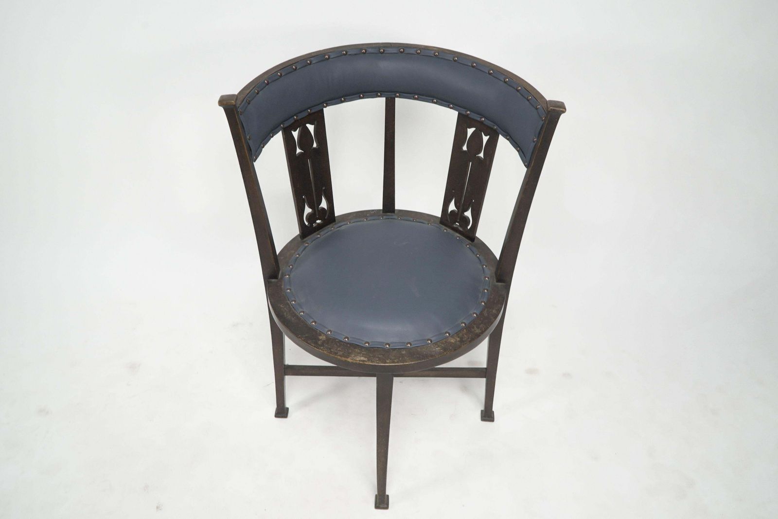An Arts And Crafts Mahogany Tub Chair With Stylized Floral Cut Outs photo vinterior