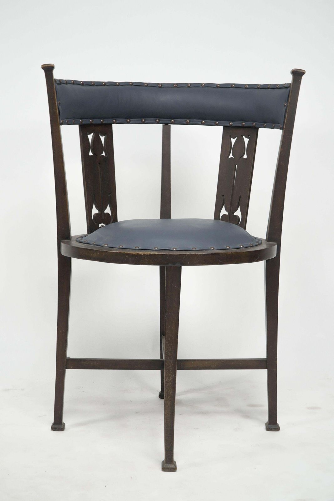 An Arts And Crafts Mahogany Tub Chair With Stylized Floral Cut Outs photo buy