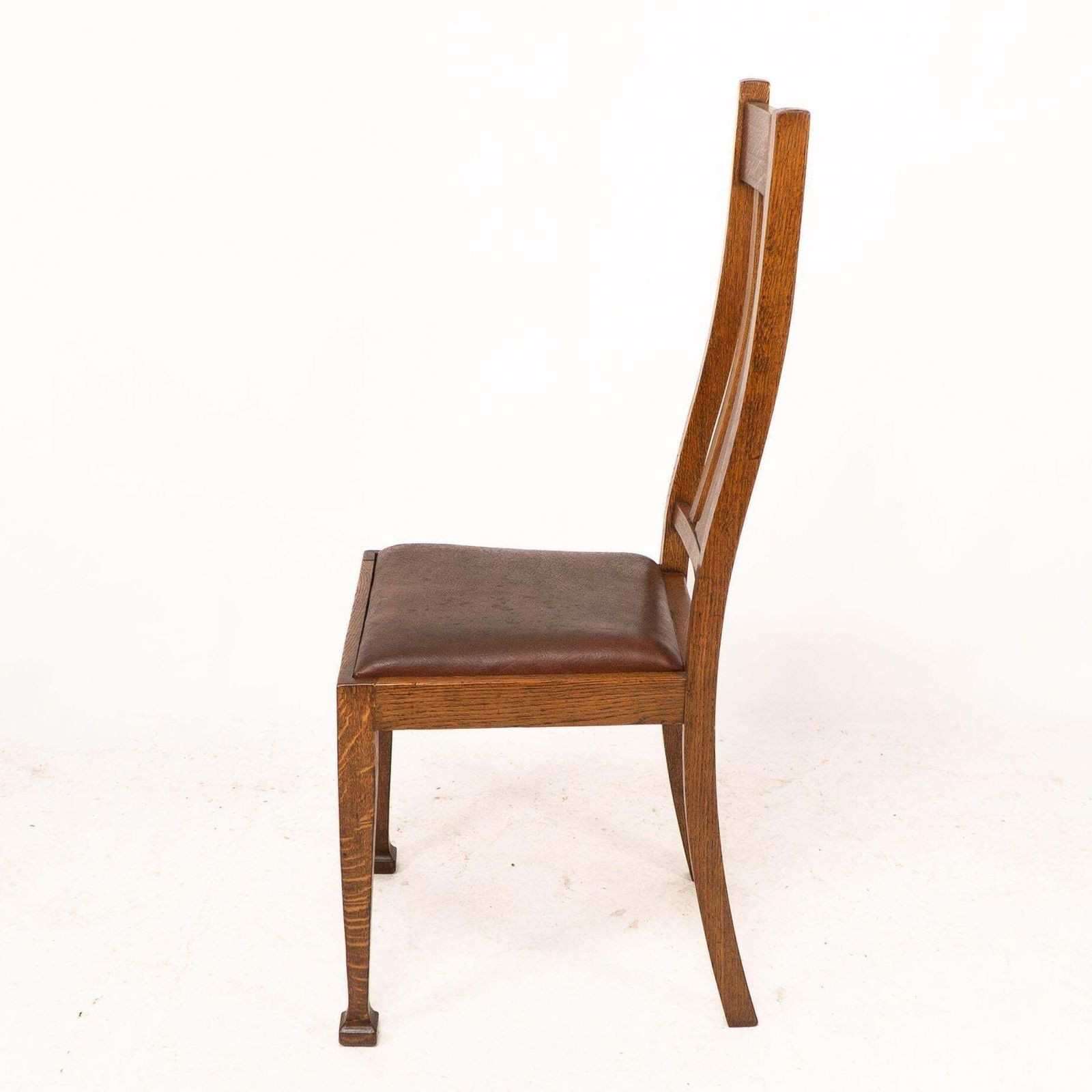 A Set Of Four Arts And Crafts Oak Dining Chairs With Comfortable Shaped Backs photo vinterior