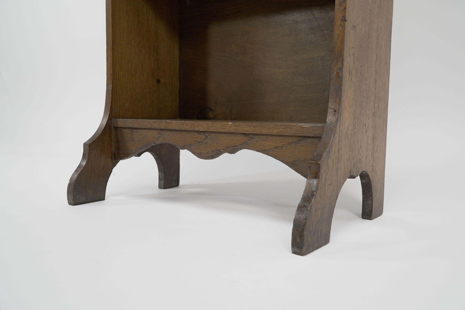 Liberty & Co. A Slim Arts And Crafts Oak Bookcase With Stylized Floral Cut Outs photo vinterior