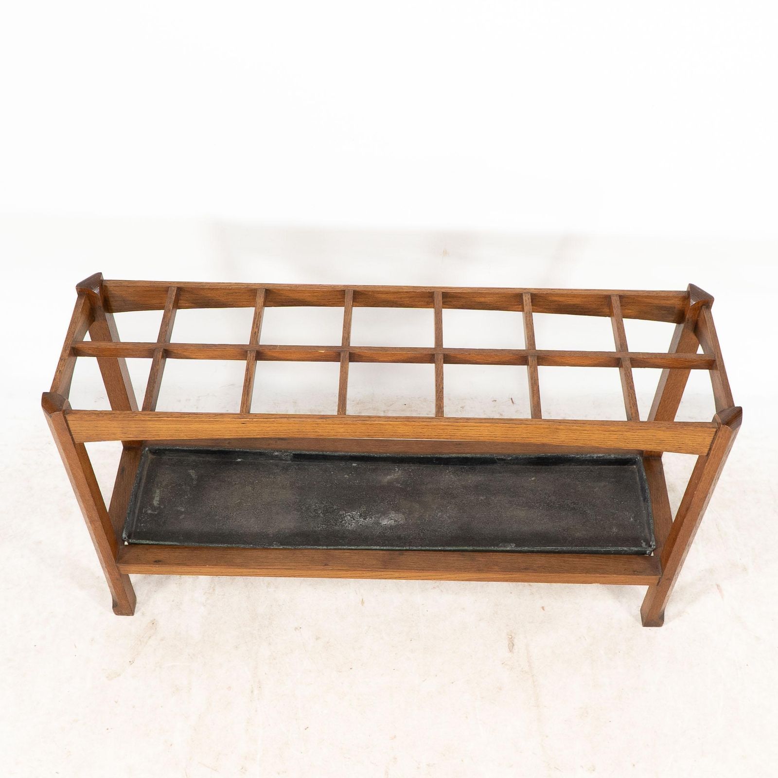 photo furniture An Arts And Crafts Oak Stick And Umbrella Stand With Fourteen Sections