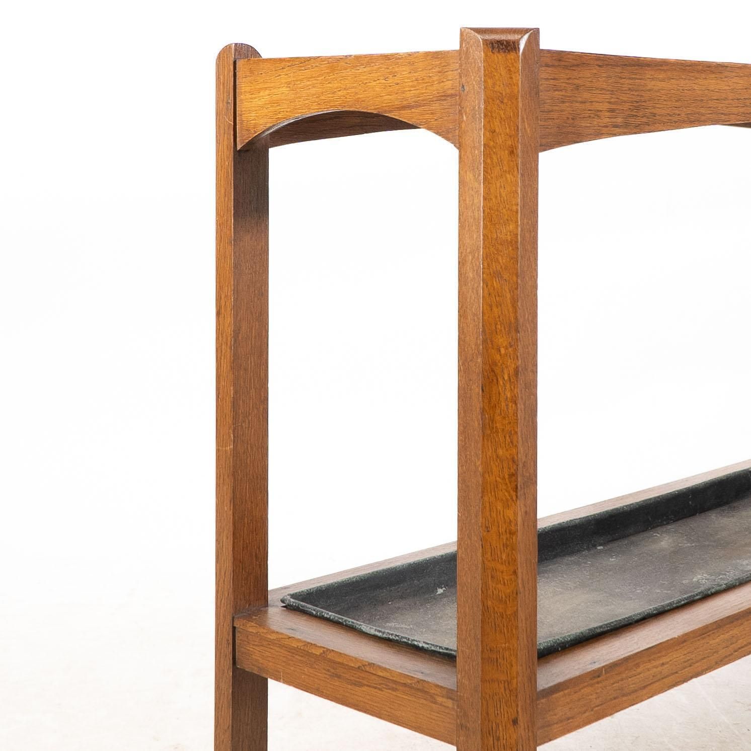 photo for sale An Arts And Crafts Oak Stick And Umbrella Stand With Fourteen Sections
