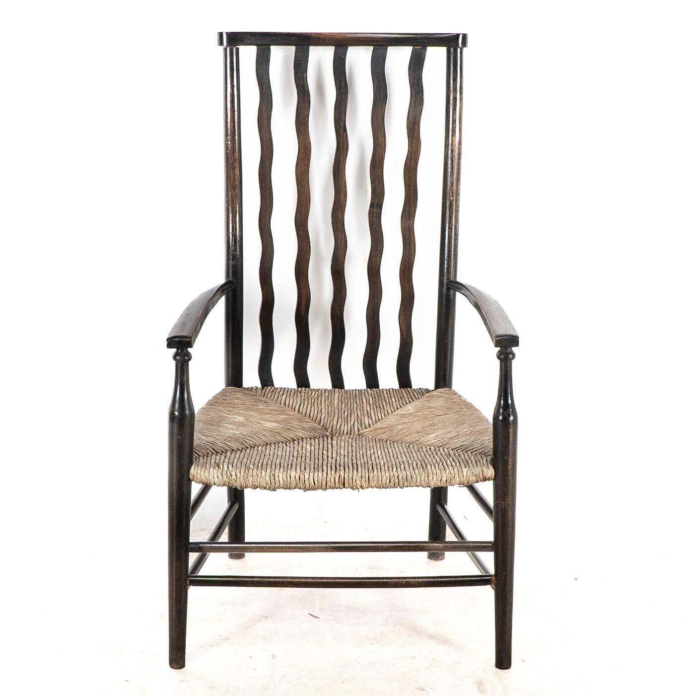 Liberty & Co. An Arts & Crafts Rush Seat Armchair With Wavy Shaped Back Slats photo furniture